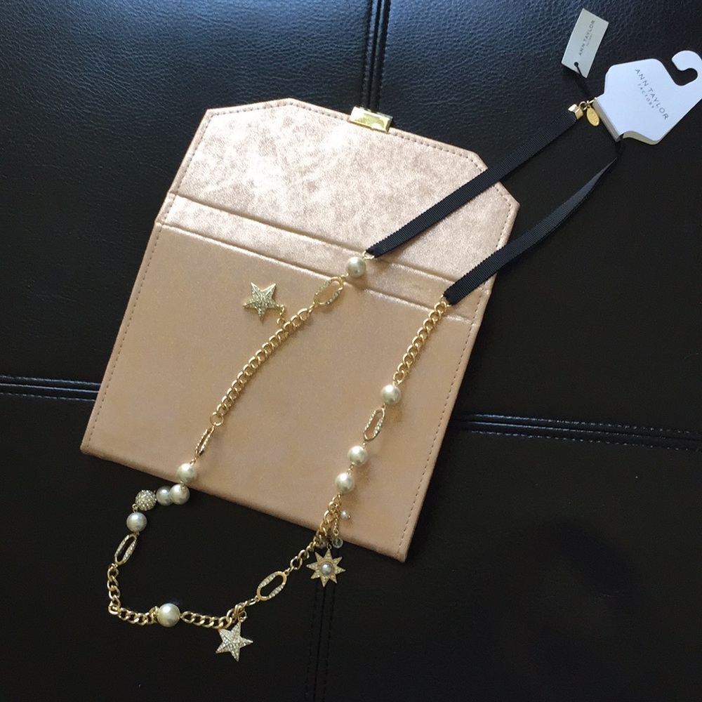 Long pave pearl star goldtone necklace on ribbon